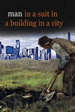 Man in a Suit in a Building in a City